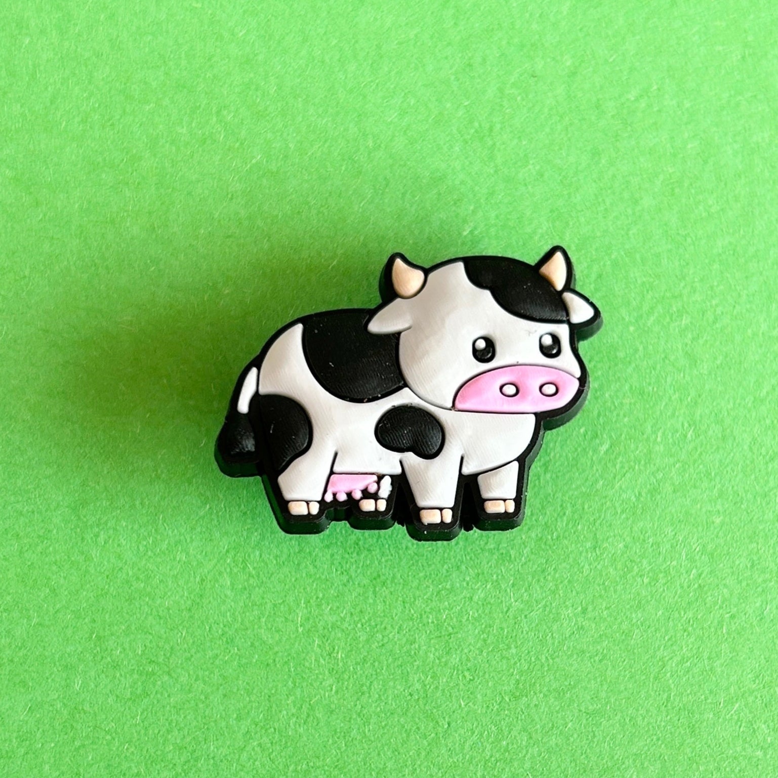 Black and white freesia cow croc shoe charm. 