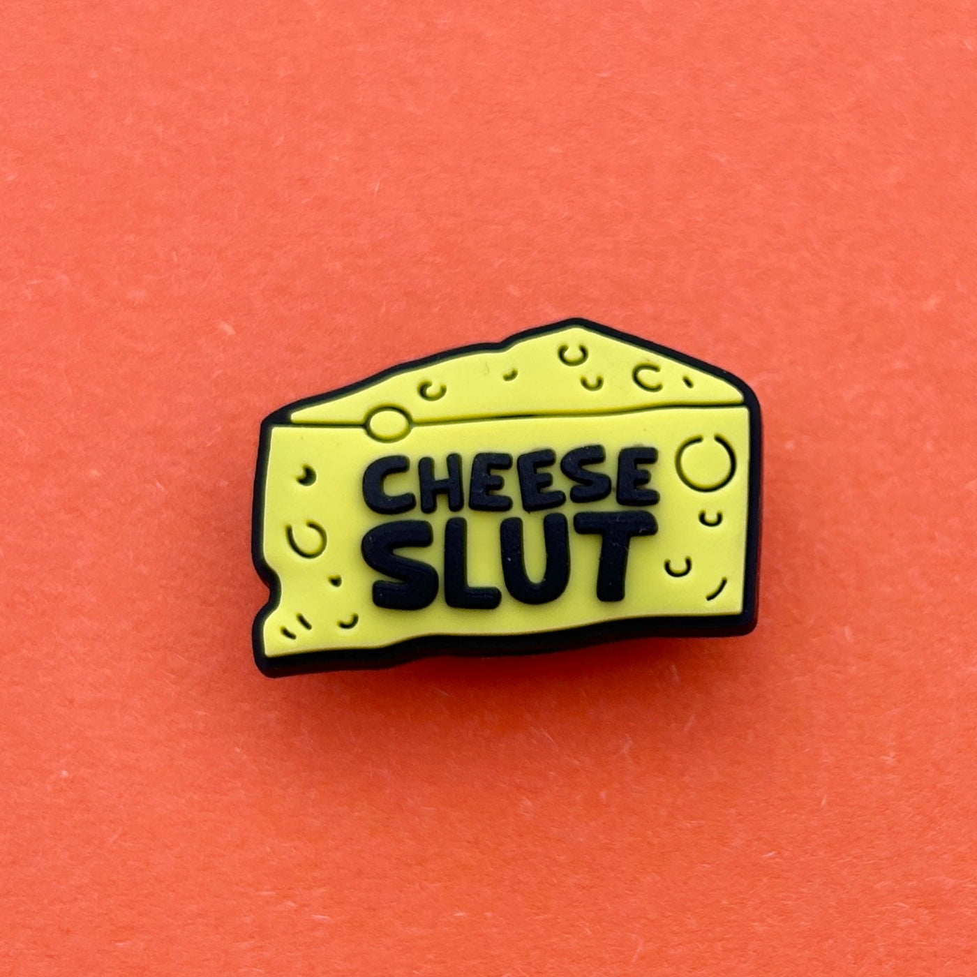Cheese Slut croc like shoe charm. Yellow and Black.