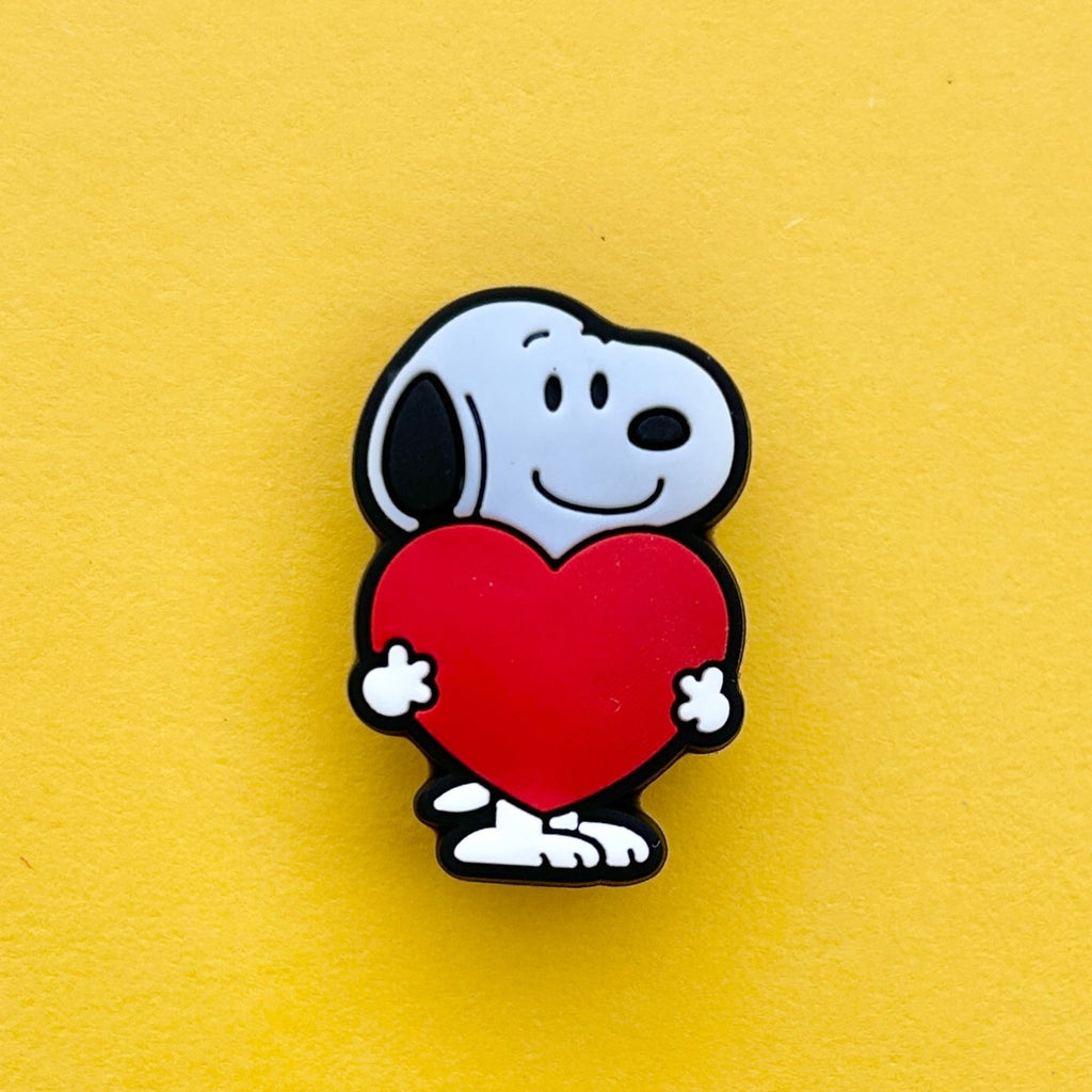 Cartoon Black and White Beagle shoe charm holding a heart.