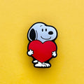 Cartoon Black and White Beagle shoe charm holding a heart.