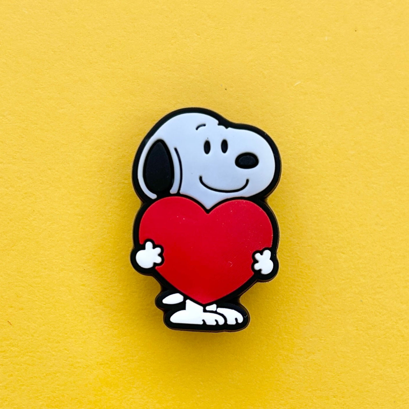 Cartoon Black and White Beagle shoe charm holding a heart.
