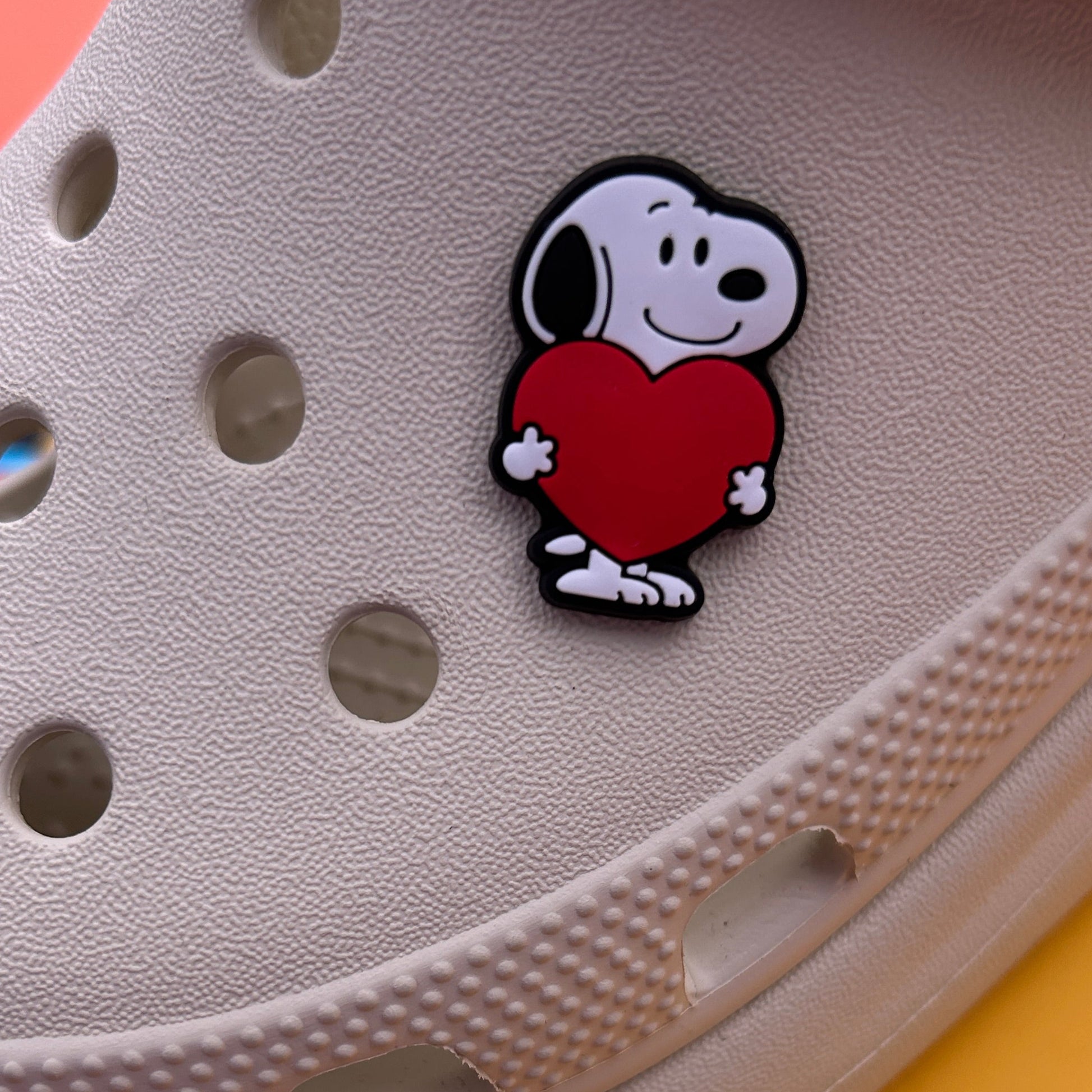Cartoon Black and White Beagle shoe charm holding a heart. Modelled on a cream croc shoe. 