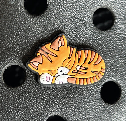 Super cute sleeping ginger cat croc like shoe charm. 