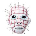 Pinhead from hellraiser pin cushion with pins. White background.