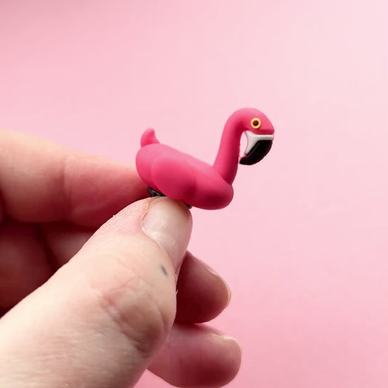 Short movie of the pink 3D Flamingo bird croc like shoe charm.