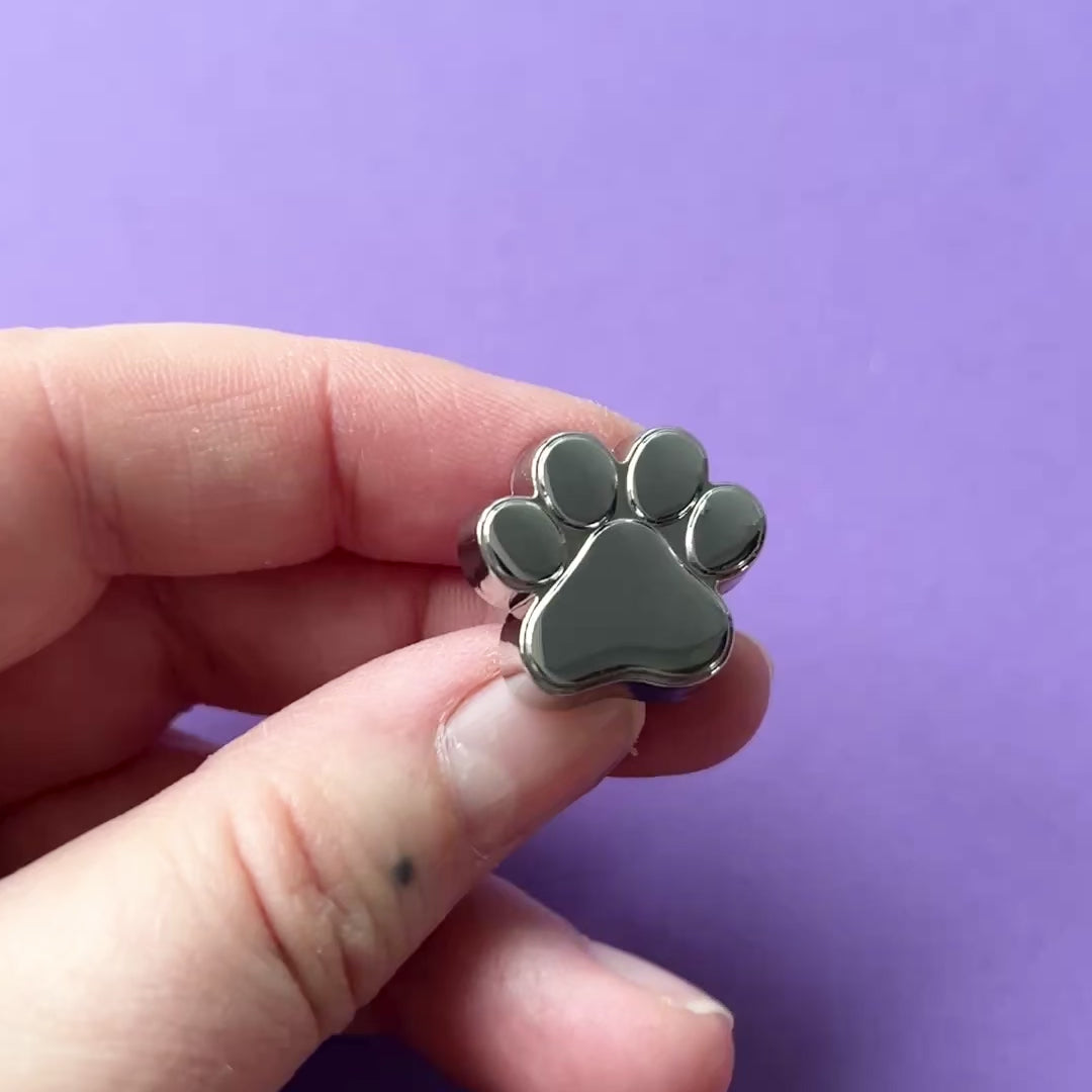 Short movie showing the silver metal dog paw. 