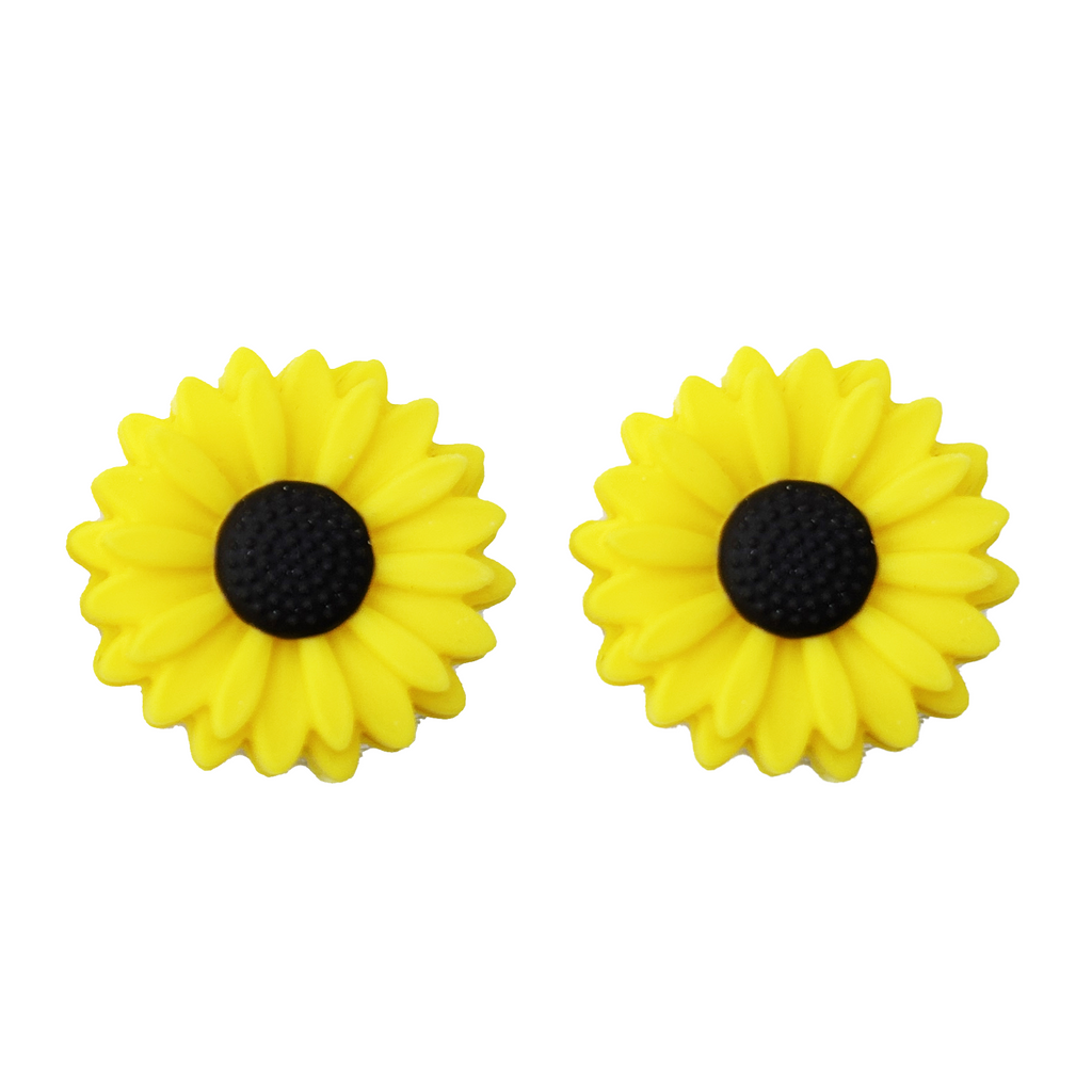 Yellow sunflower knitting needle point protectors on a white background